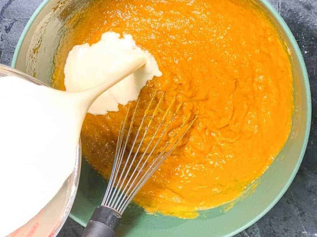 add the warm milk to the pumpkin pie filling