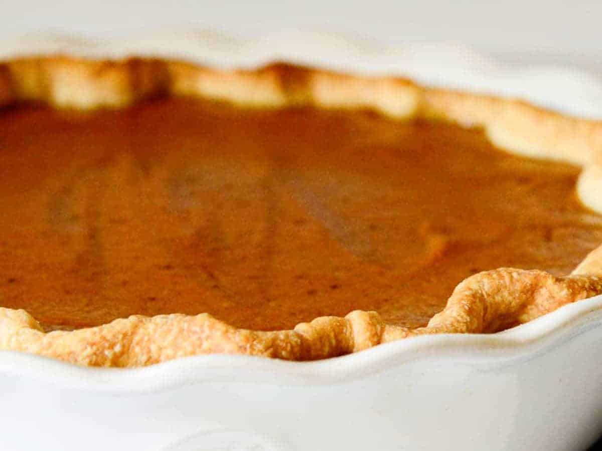 the pie crust should be golden brown and the pumpkin filling just slightly jiggly