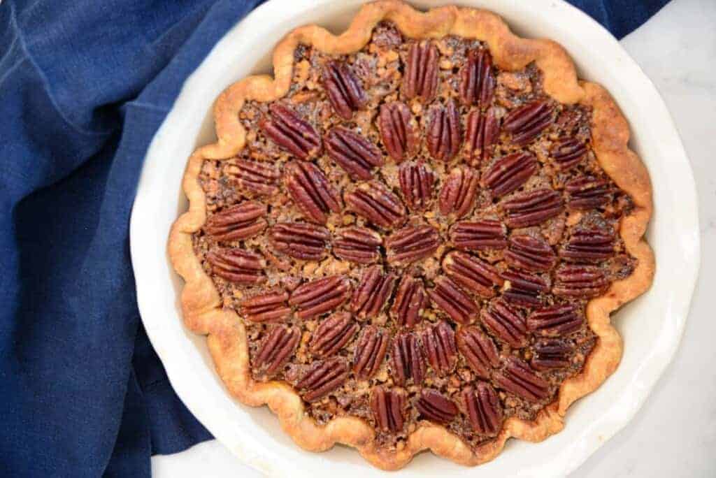 Pecan pie in a white pie dish