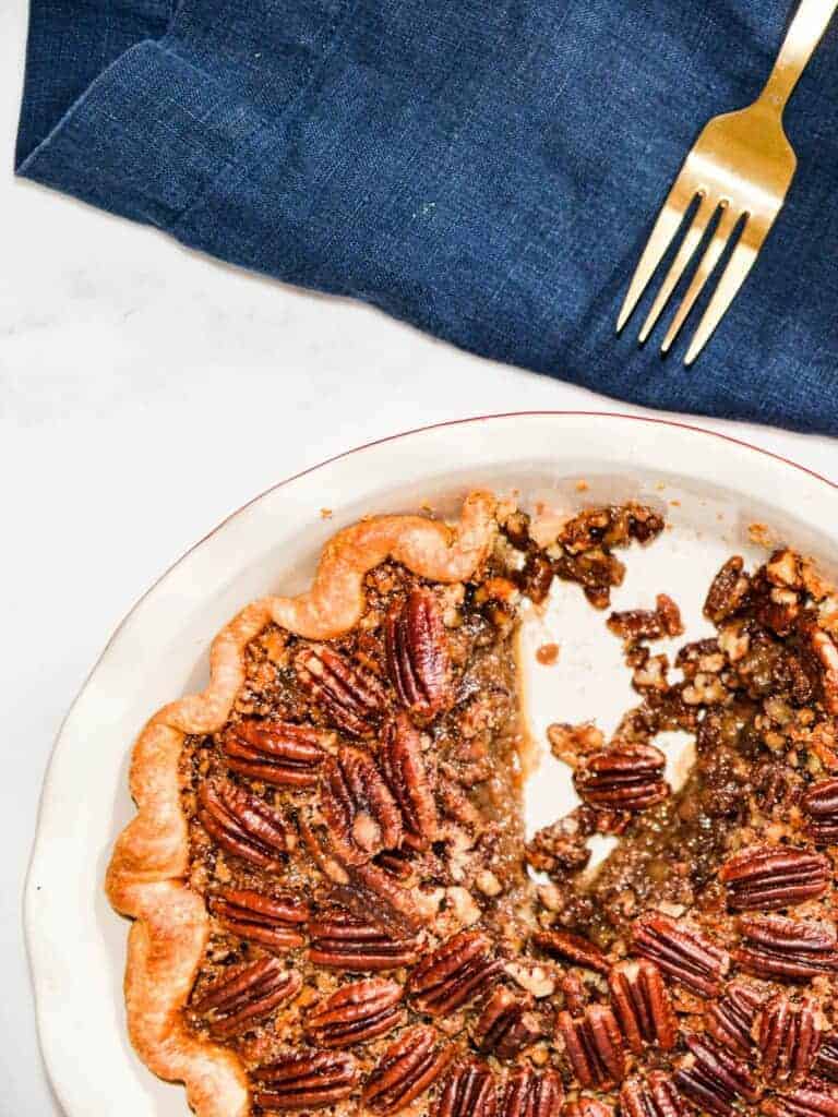 The best pecan pie recipe made with maple syrup, one slice cut out