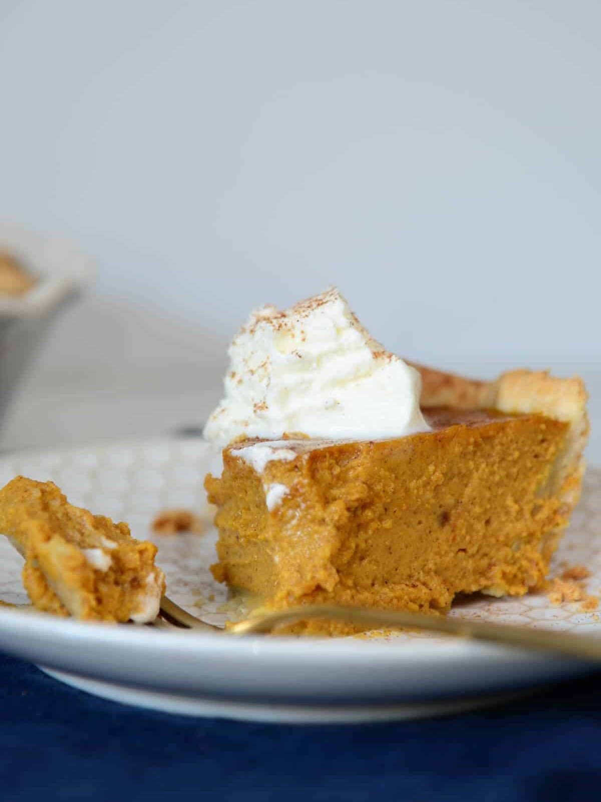 pumpkin pie topped with whipped cream