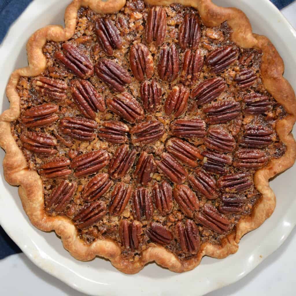 Pecan pie recipe in a an emile henry pie dish