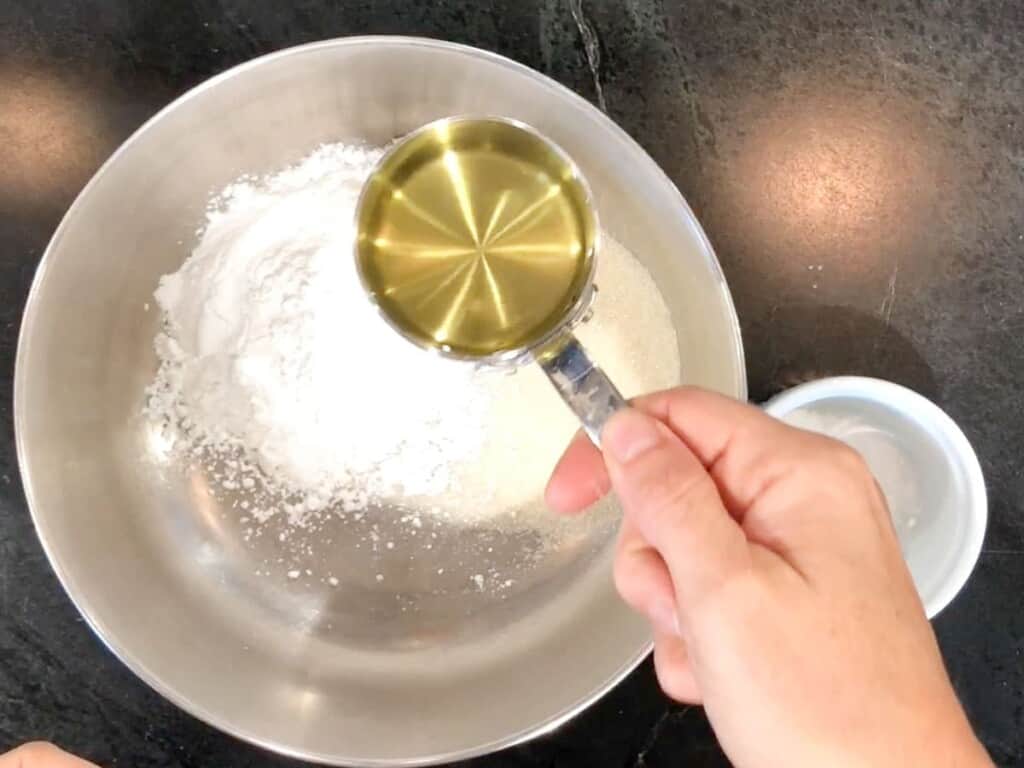 adding a half cup of oil to sugar cookie dough