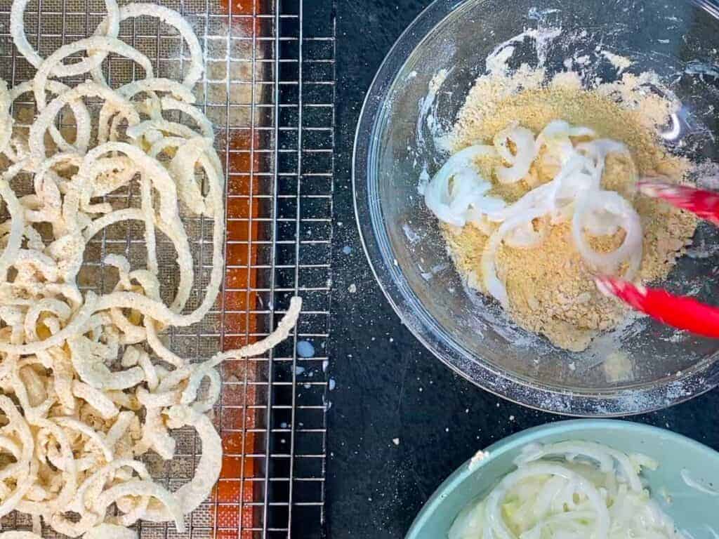 breading the onions for baking