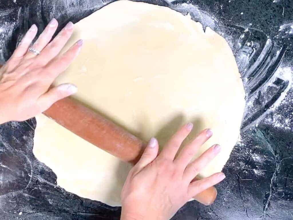 roll the pie dough out with a rolling pin