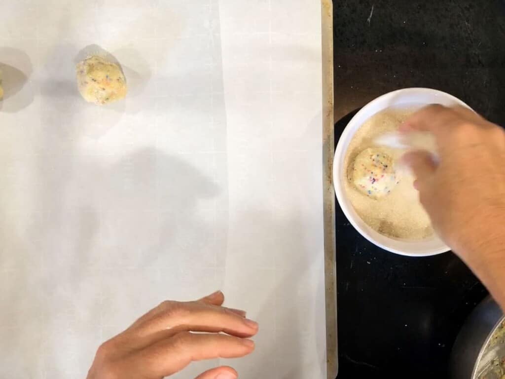 drop the balls of cookie dough into granulatedsugar