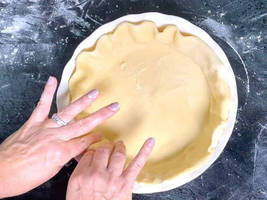 use your fingers to crimp the edge of the pie crust