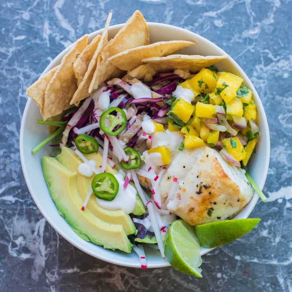 add a few tortilla chips to the bowl