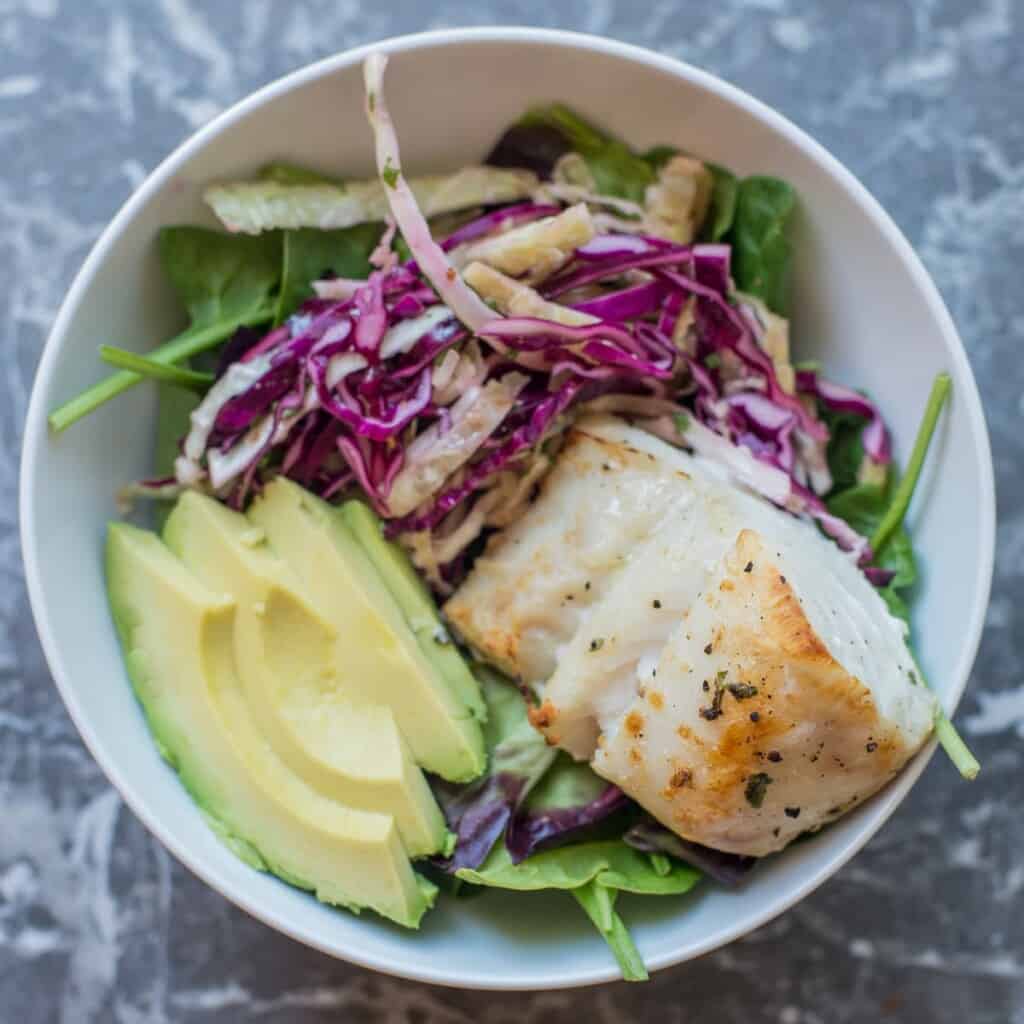 add the tequiila lime fish to the meal prep bowl