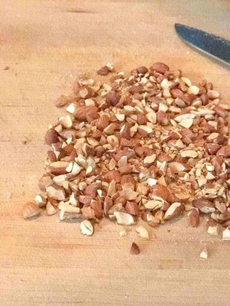 chopped almonds on a cutting board