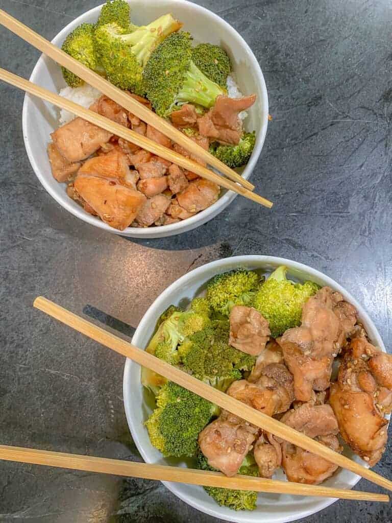 two bowls of chicken and broccoli