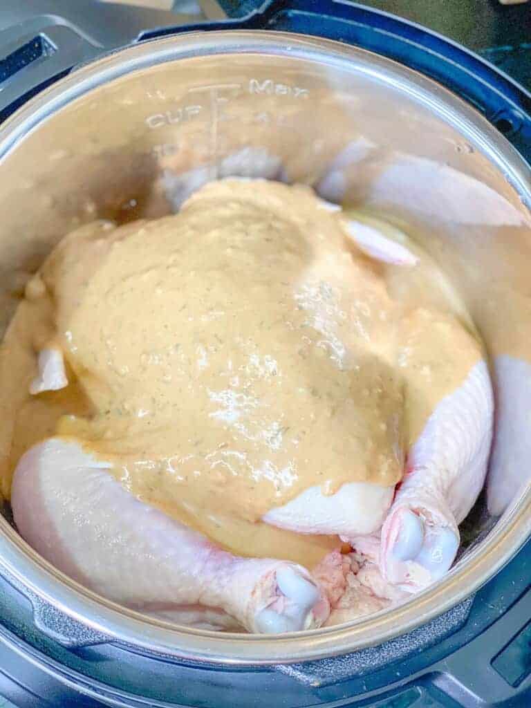 a whole chicken in an instant pot with 2 packages of Kevin's lemongrass basil sauce