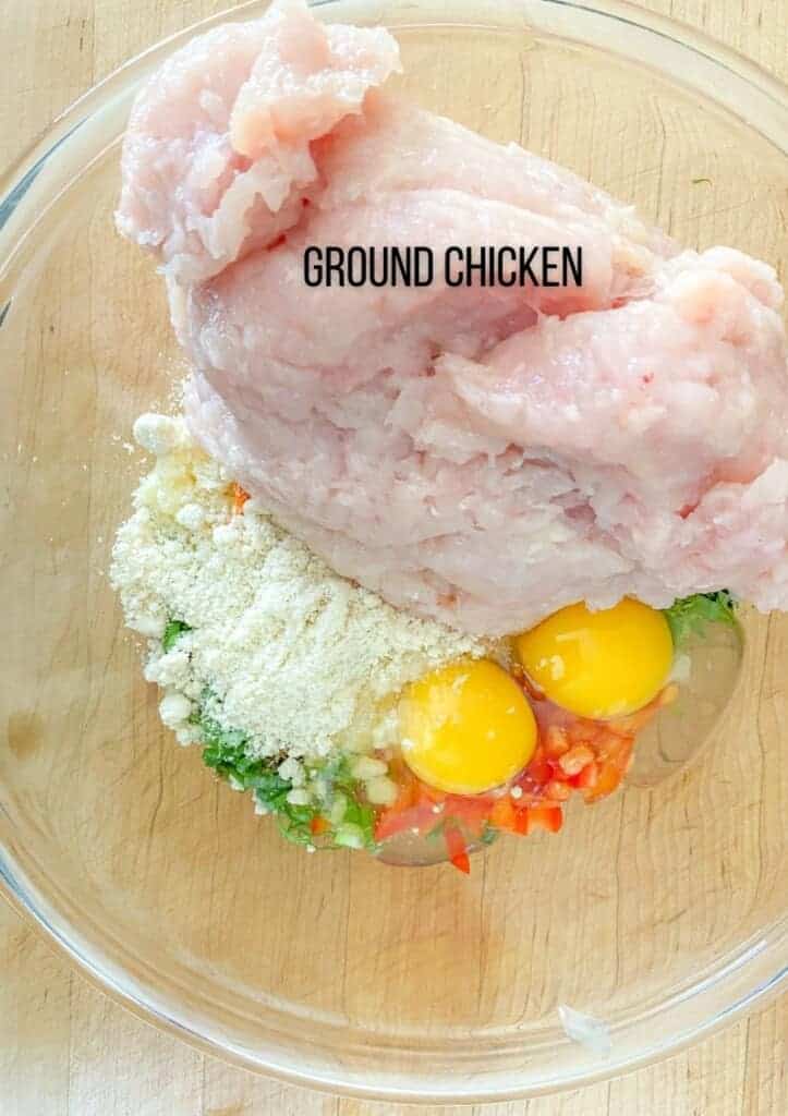 adding in the ground chicken for asian chicken meatballs