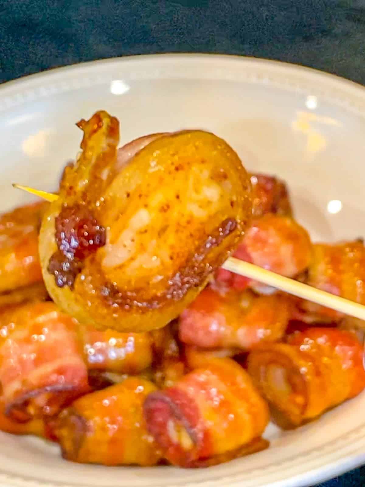 bacon wrapped shrimp on a toothpick