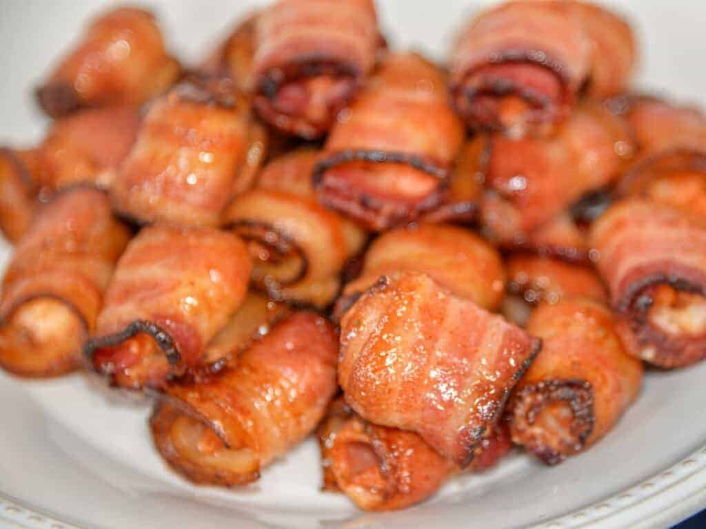 easy bacon wrapped shrimp on a white plate