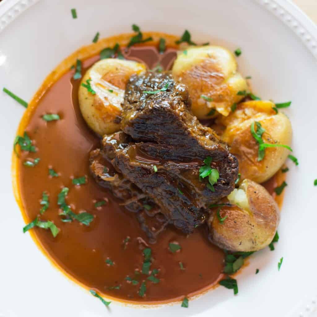 braised beef short ribs served with roasted potatoes