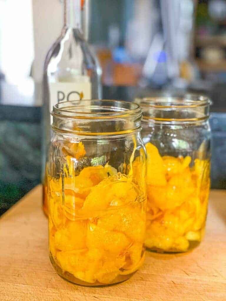 lemon peels in mason jars with alcohol, making limoncello