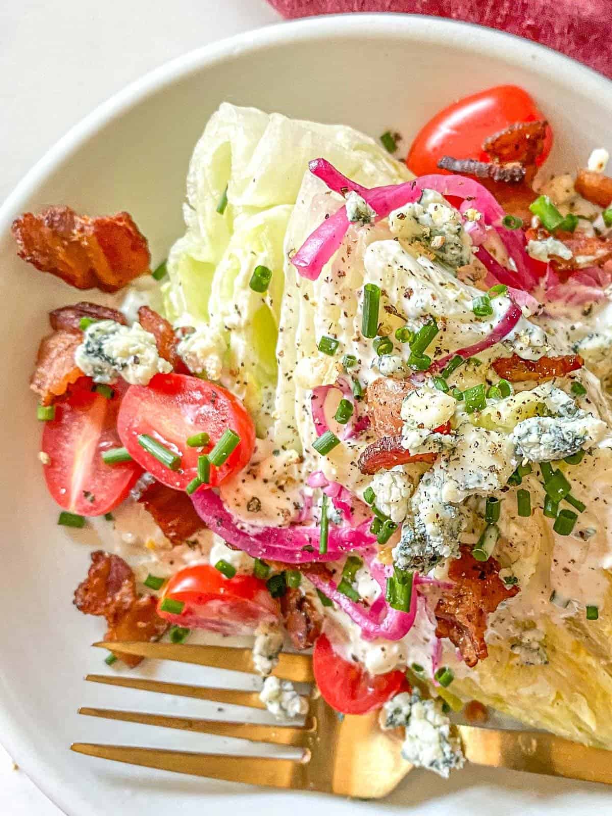 classic blue cheese wedge salad with all the toppings and homemade blue cheese dressing