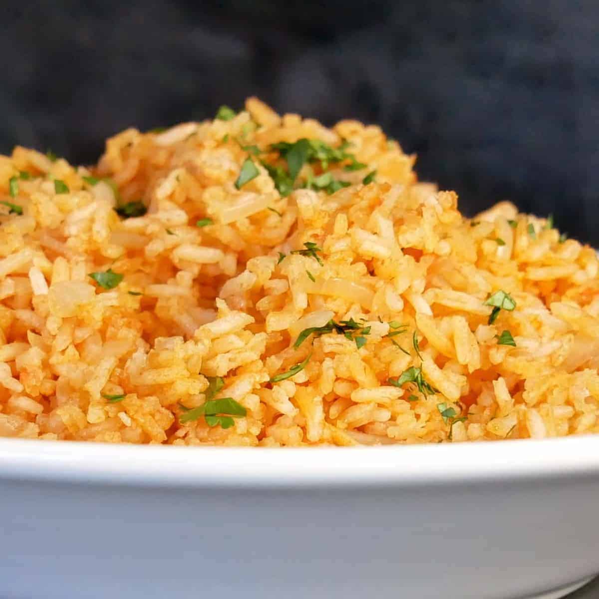 homemade restaurant style Mexican rice recipe sprinkles with fresh minced cilantro