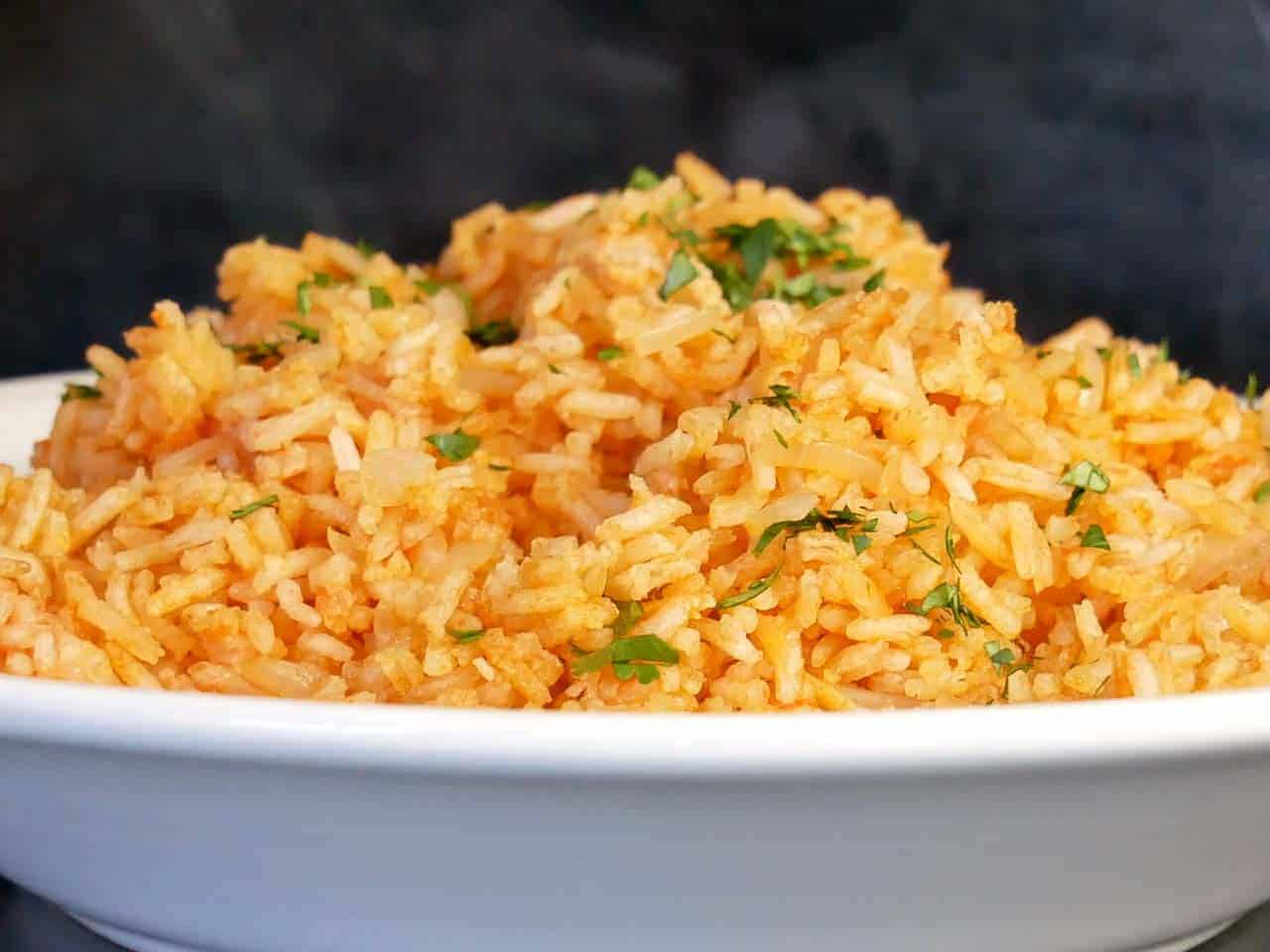 homemade restaurant style Mexican rice recipe sprinkles with fresh minced cilantro