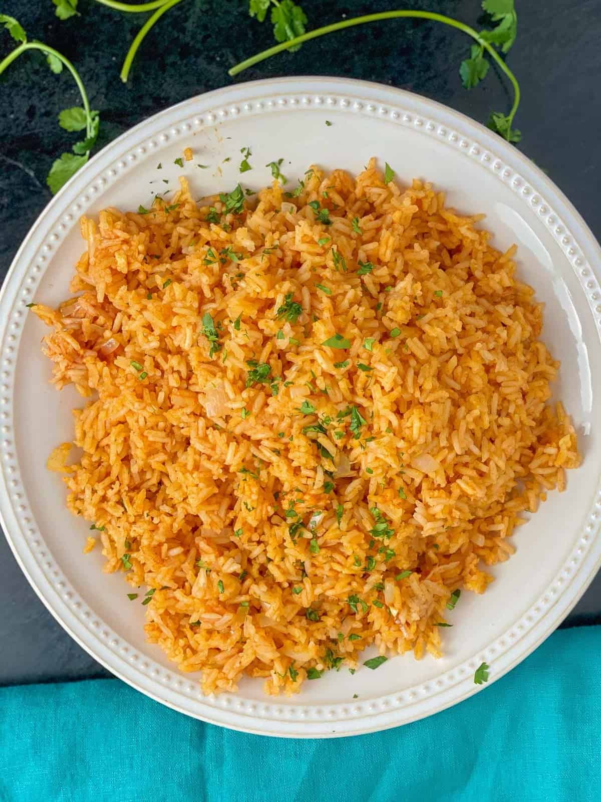 homemade restaurant style Mexican rice recipe sprinkles with fresh minced cilantro