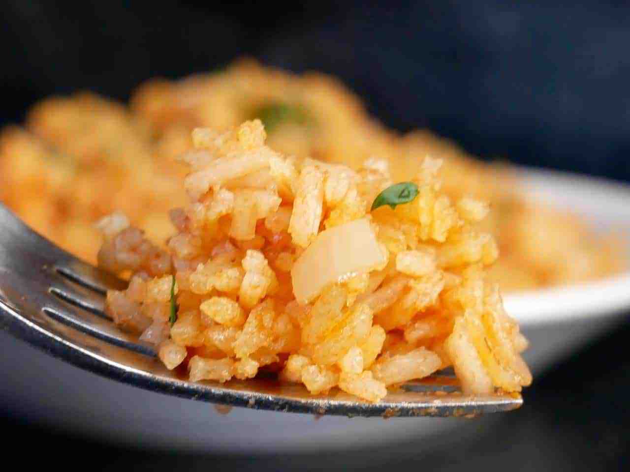 one yummy bite of fluffy mexican rice on a fork