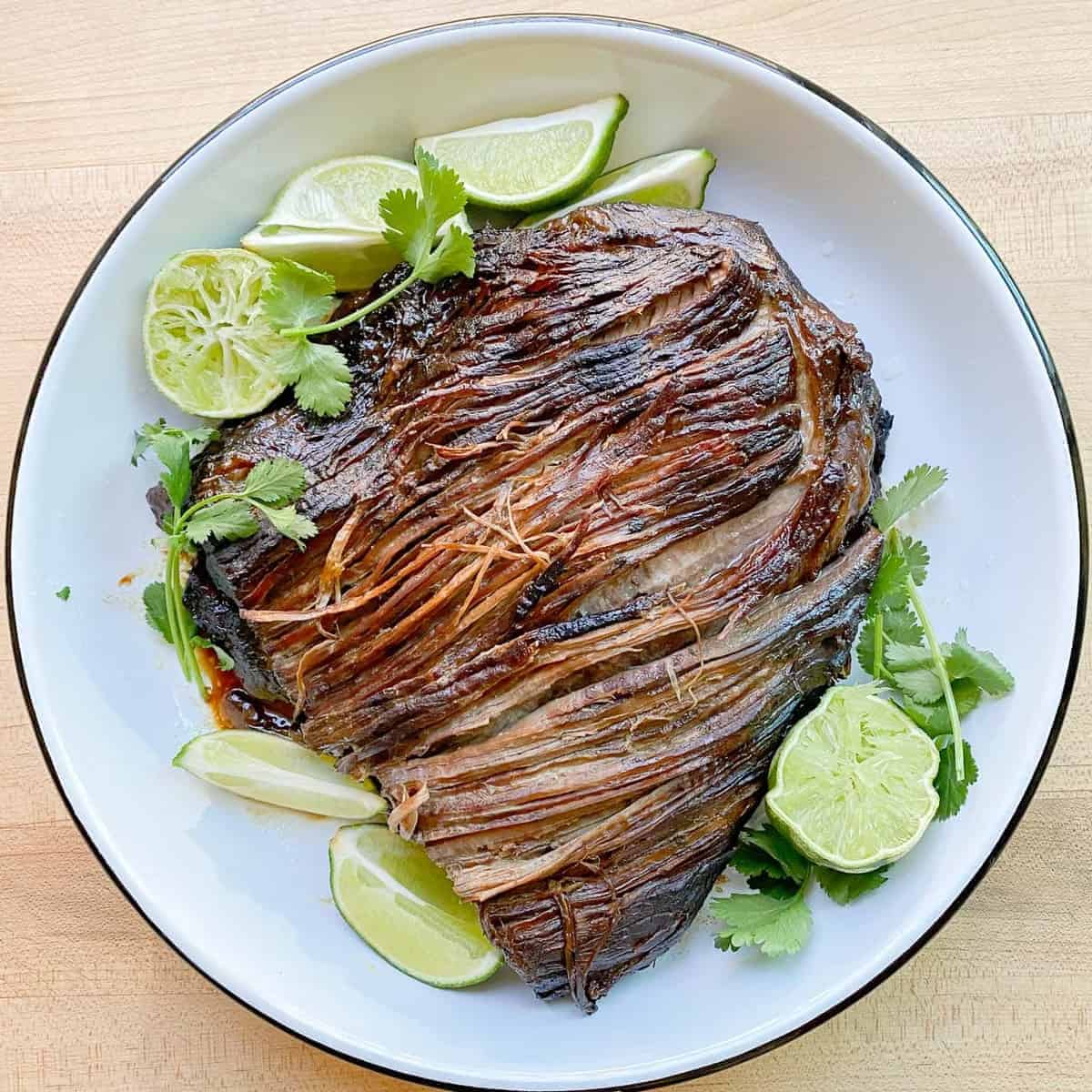 shredded beef taco recipe served with fresh limes