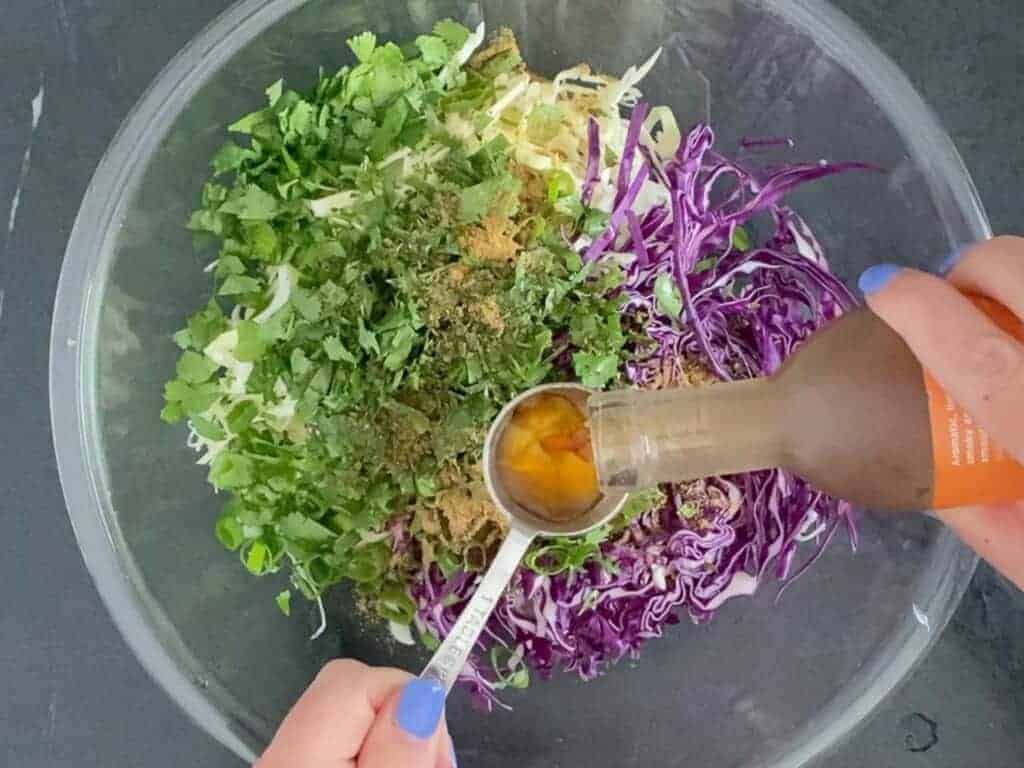 add the vinegar to the slaw