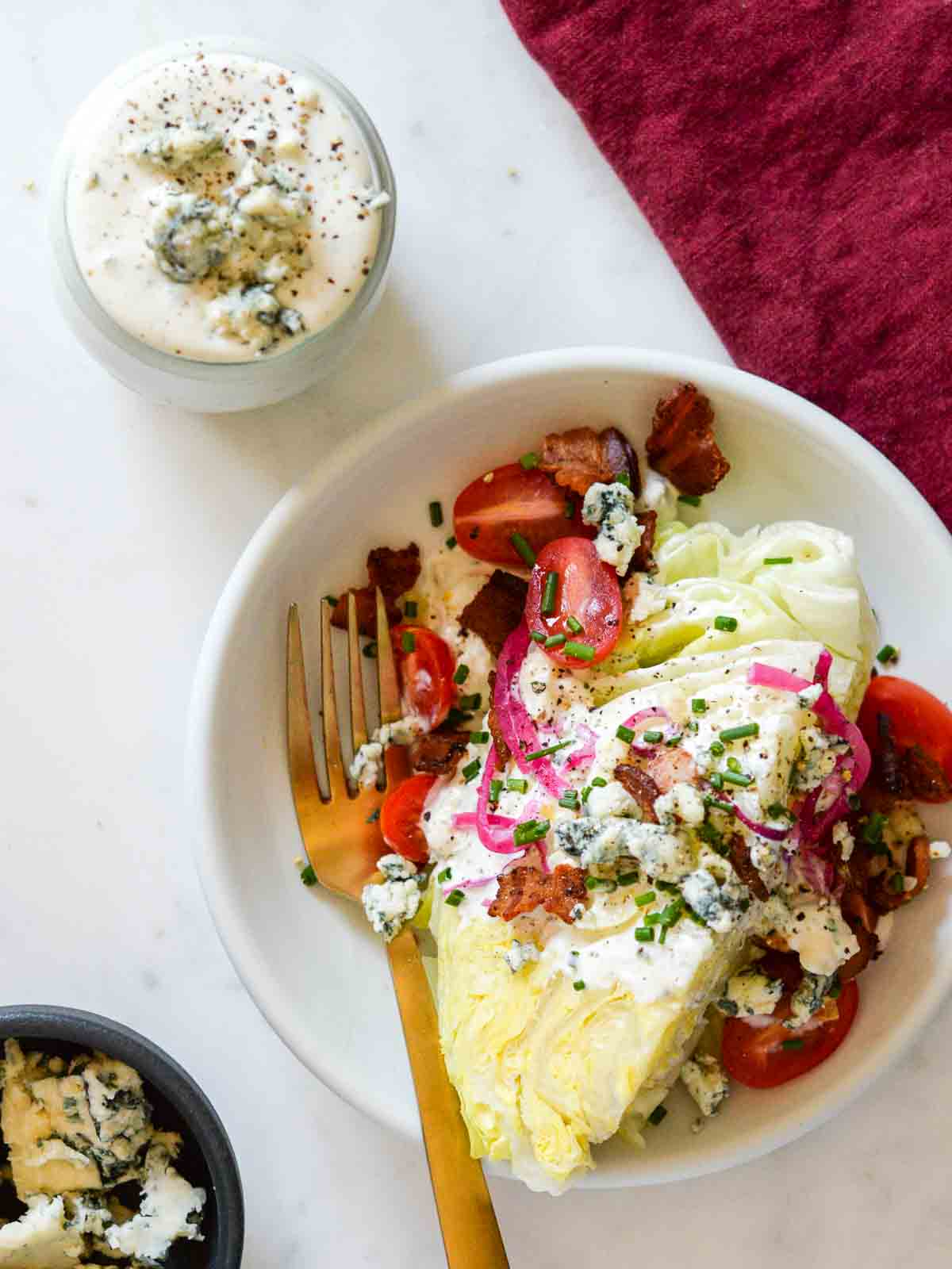 classic blue cheese wedge salad with all the toppings and homemade blue cheese dressing