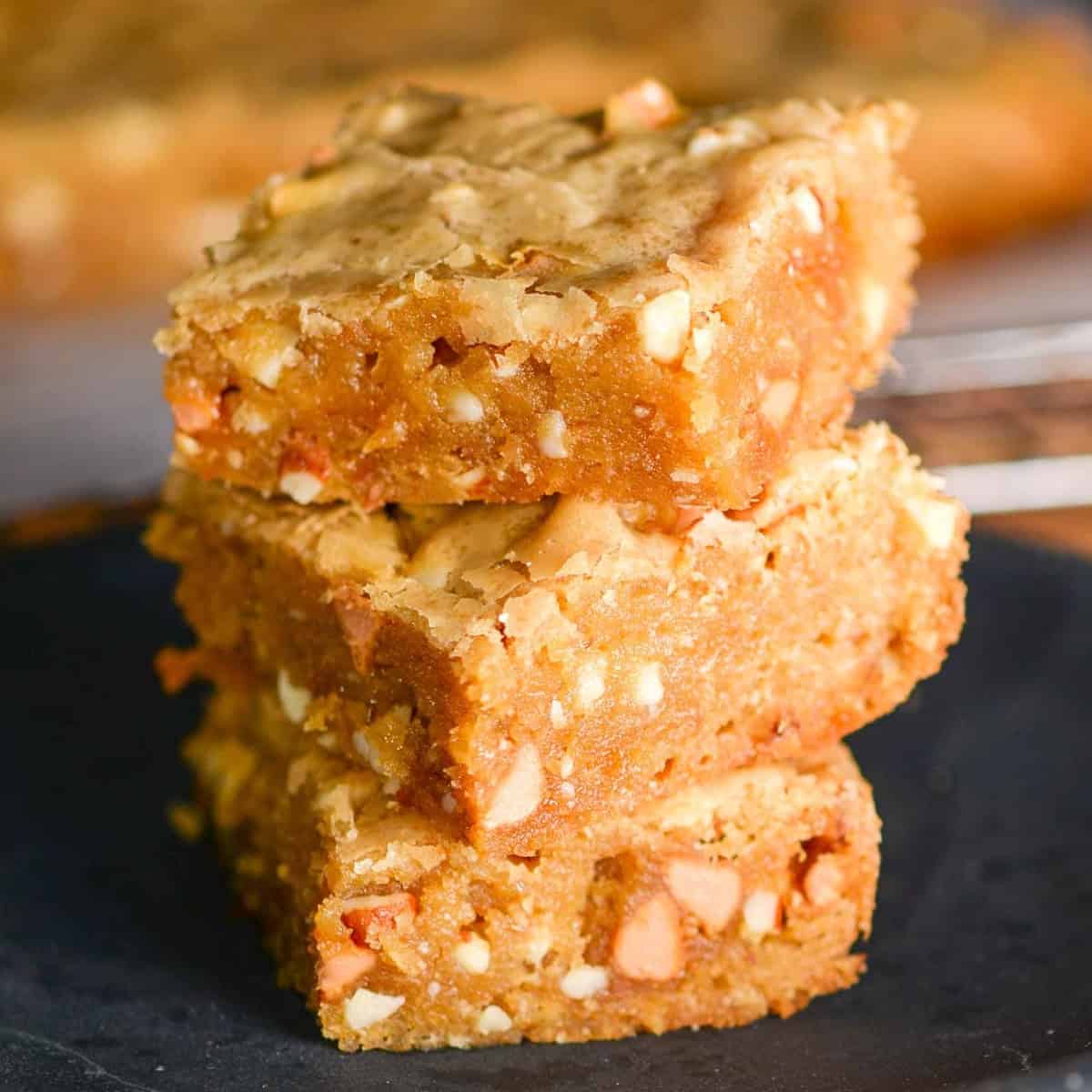 a stack of blondies with butterscotch chips