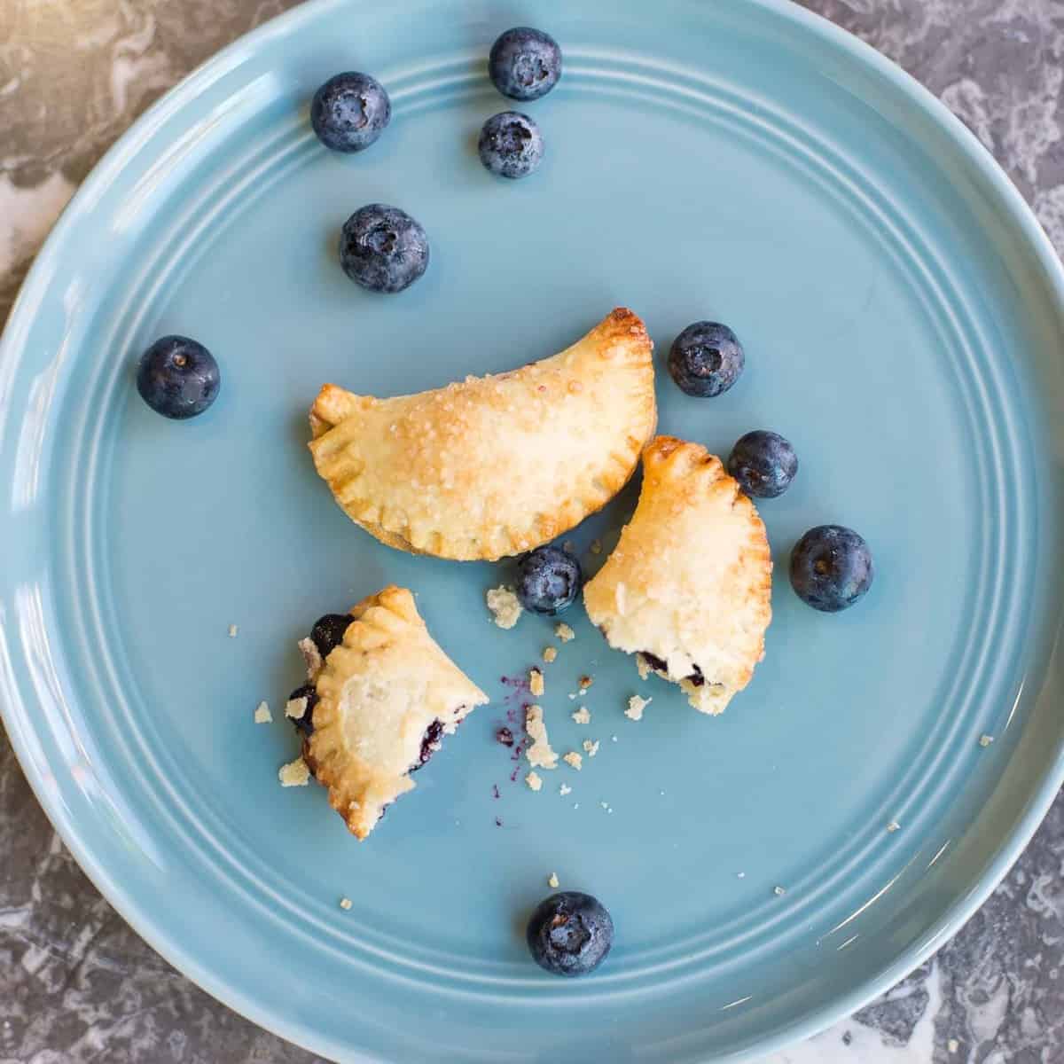 two blueberry hand pies with homemade blueberry filling