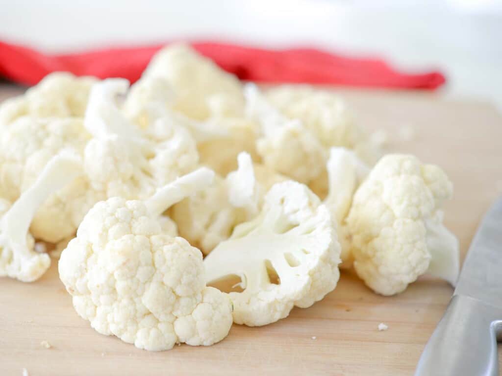 break the cauliflower apart into florets to chop in the food processor