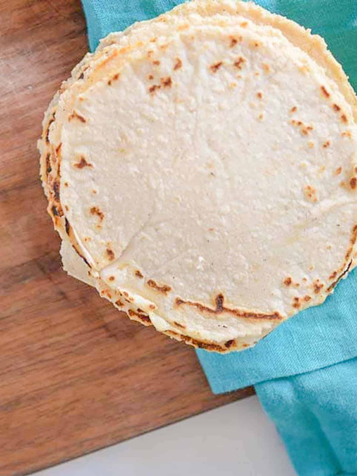 a stack of homemade corn tortillas