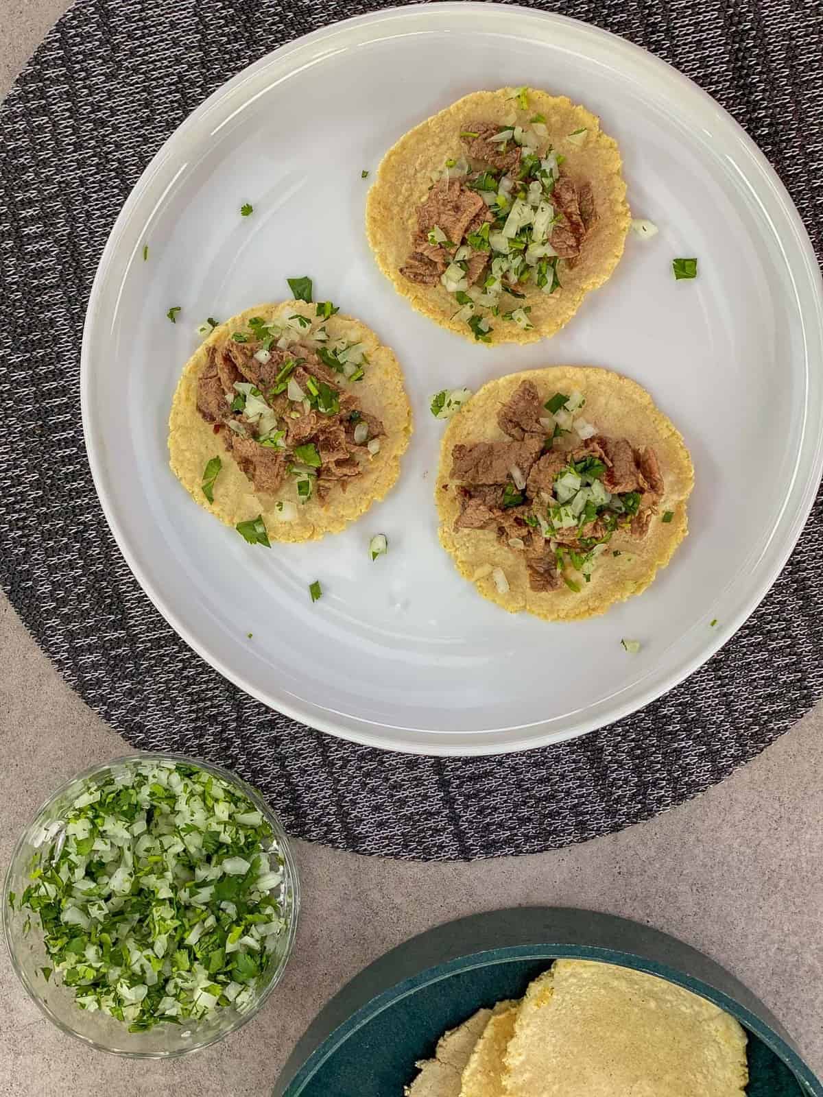 grilled carne asada on homemade corn tortillas with pico de gallo