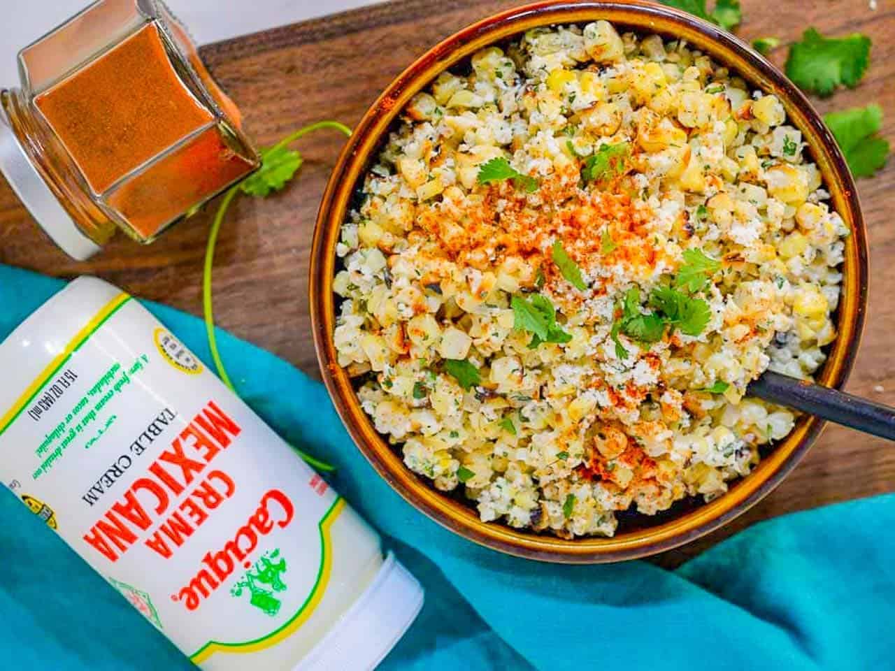 Mexican Corn Salad is a charred, buttered corn salad with a creamy dressing. AKA as Esquites - spicy, cheesy corn in a cup snack.