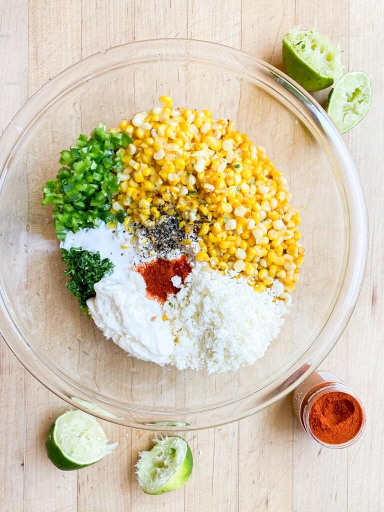 making the mexican corn salad, all the ingredients in a bowl. 