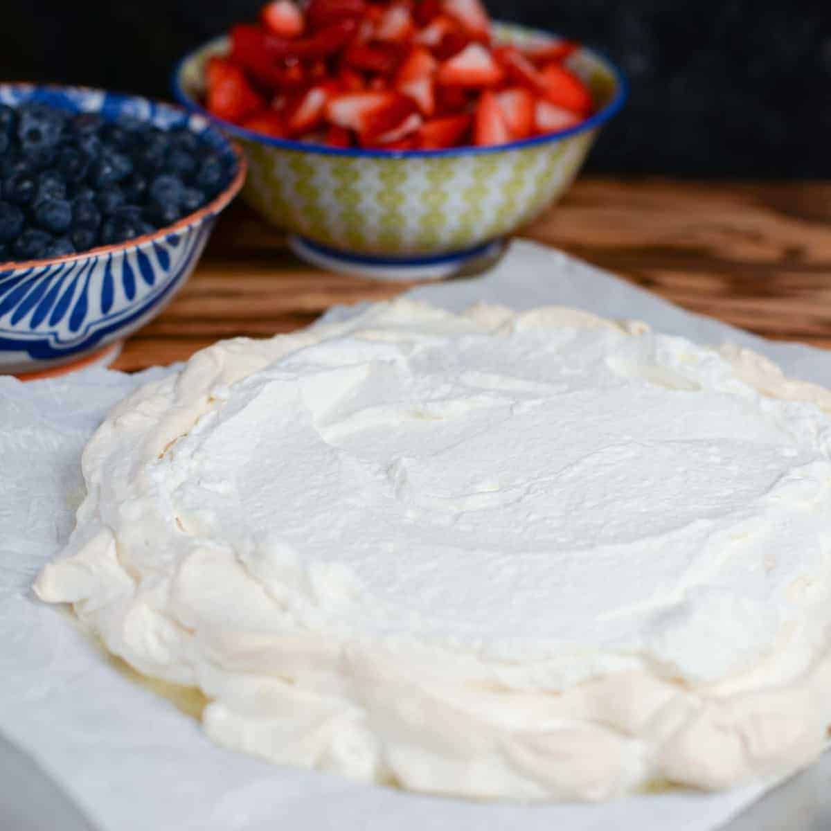 pavlova layered with whipped cream