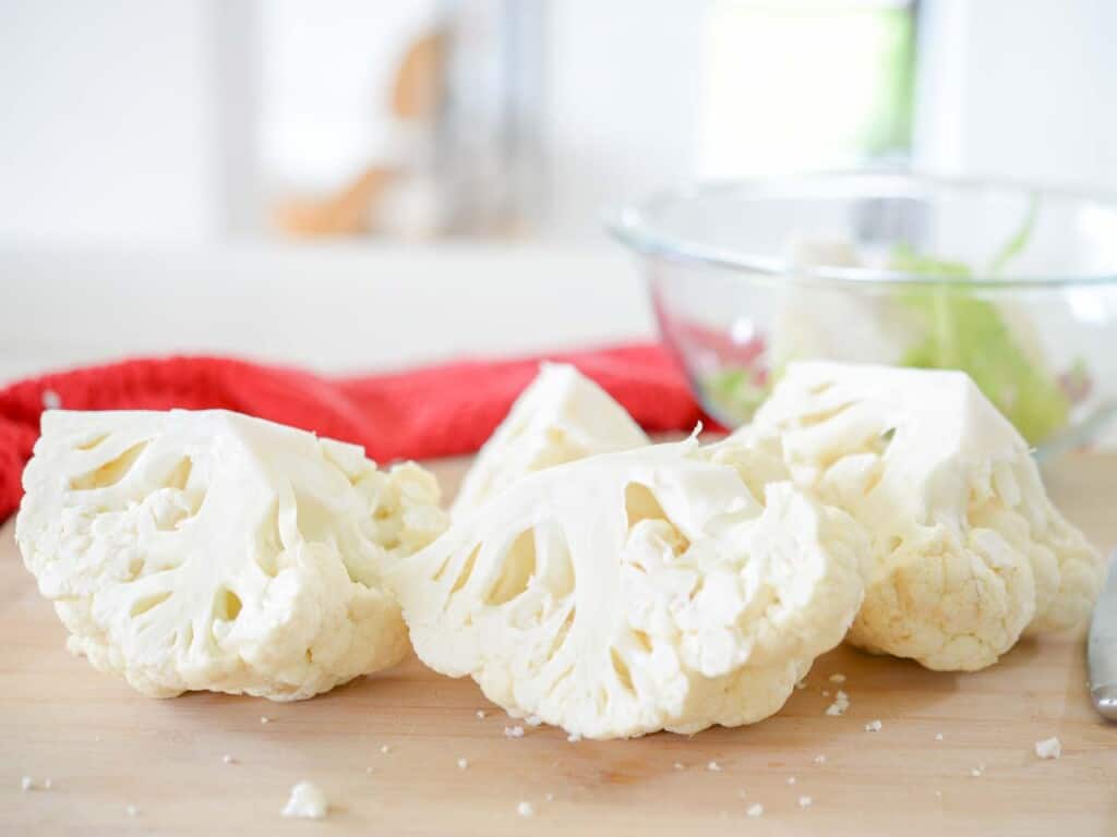 cut the leaves off of the quartered cauliflower