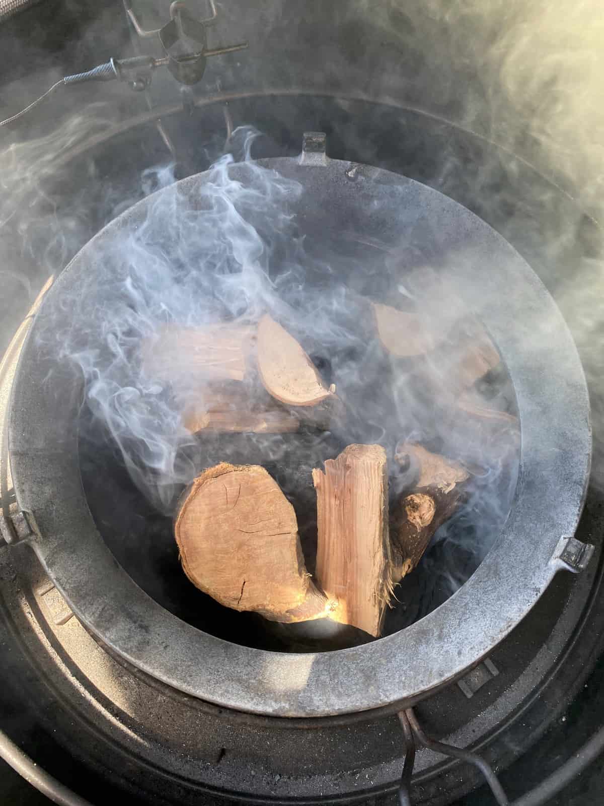 add apple and pecan wood to the belly of the ceramic grill