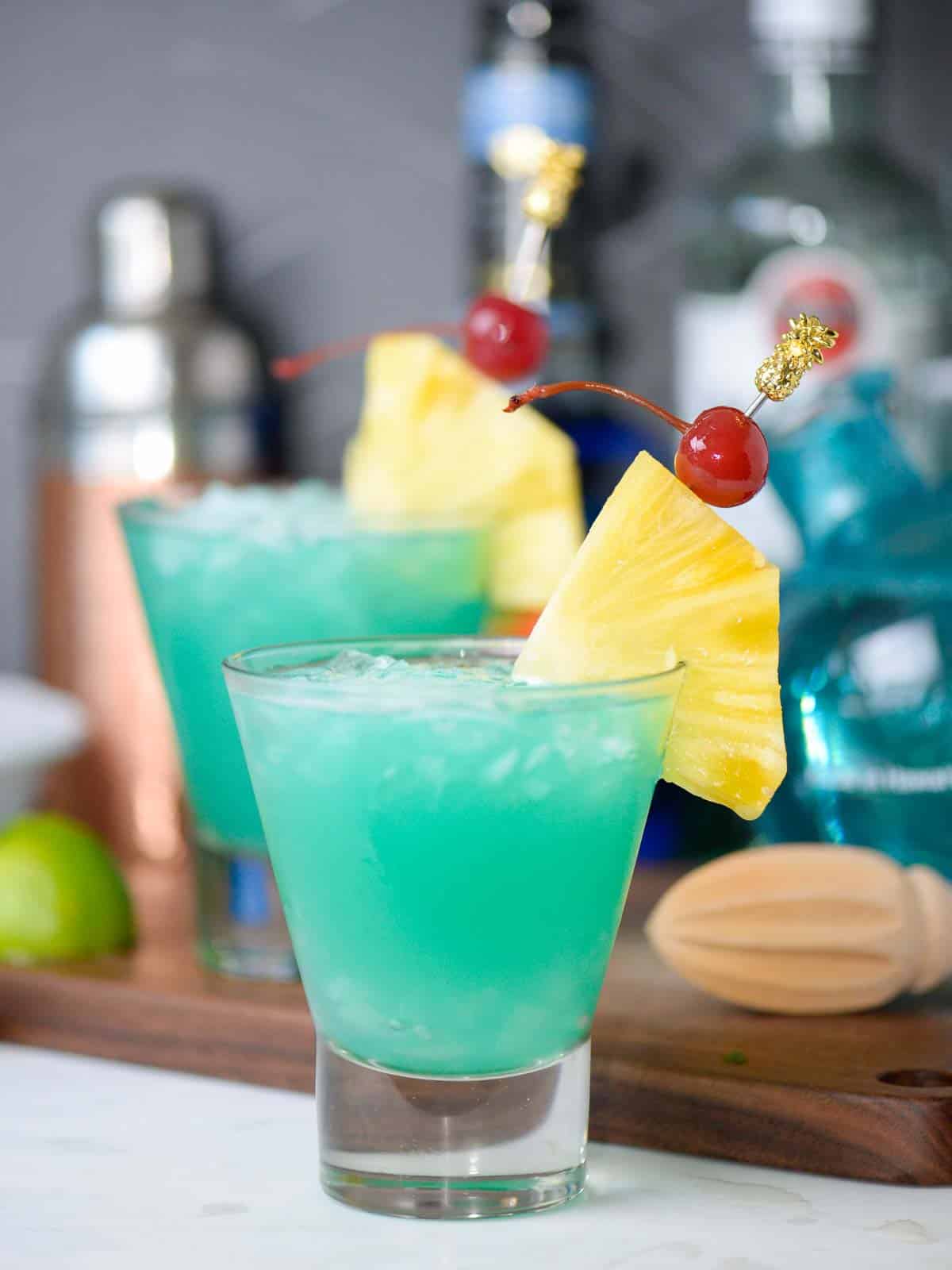 tropical cocktail recipes the blue hawaii, 2 drinks served over crushed ice