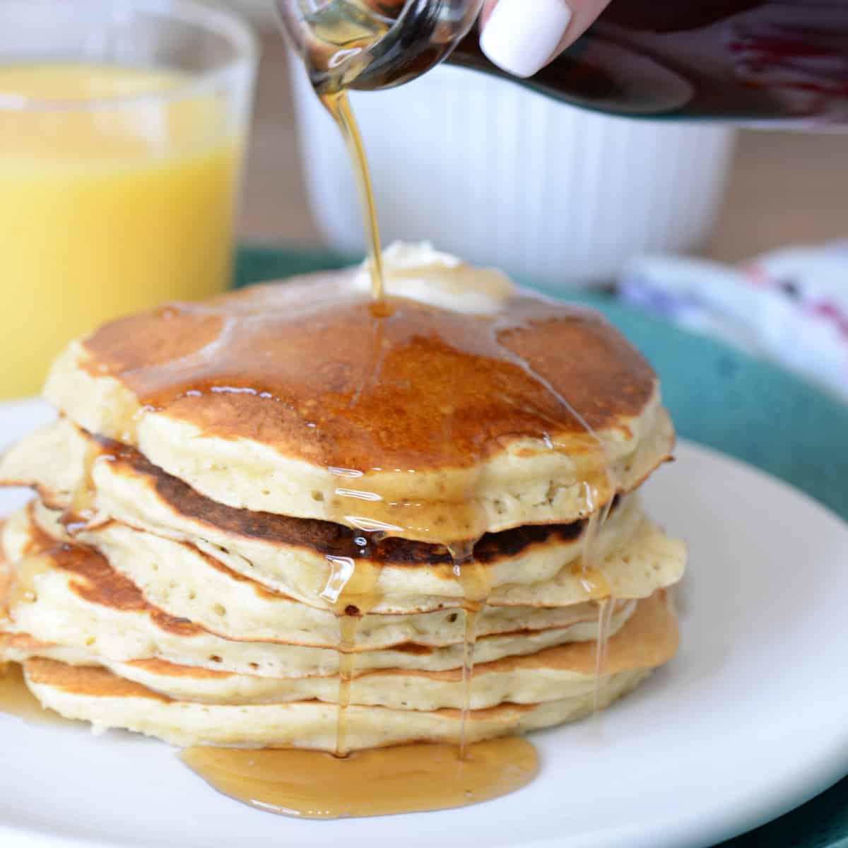 buttermilk pancakes with butter and maple syrup
