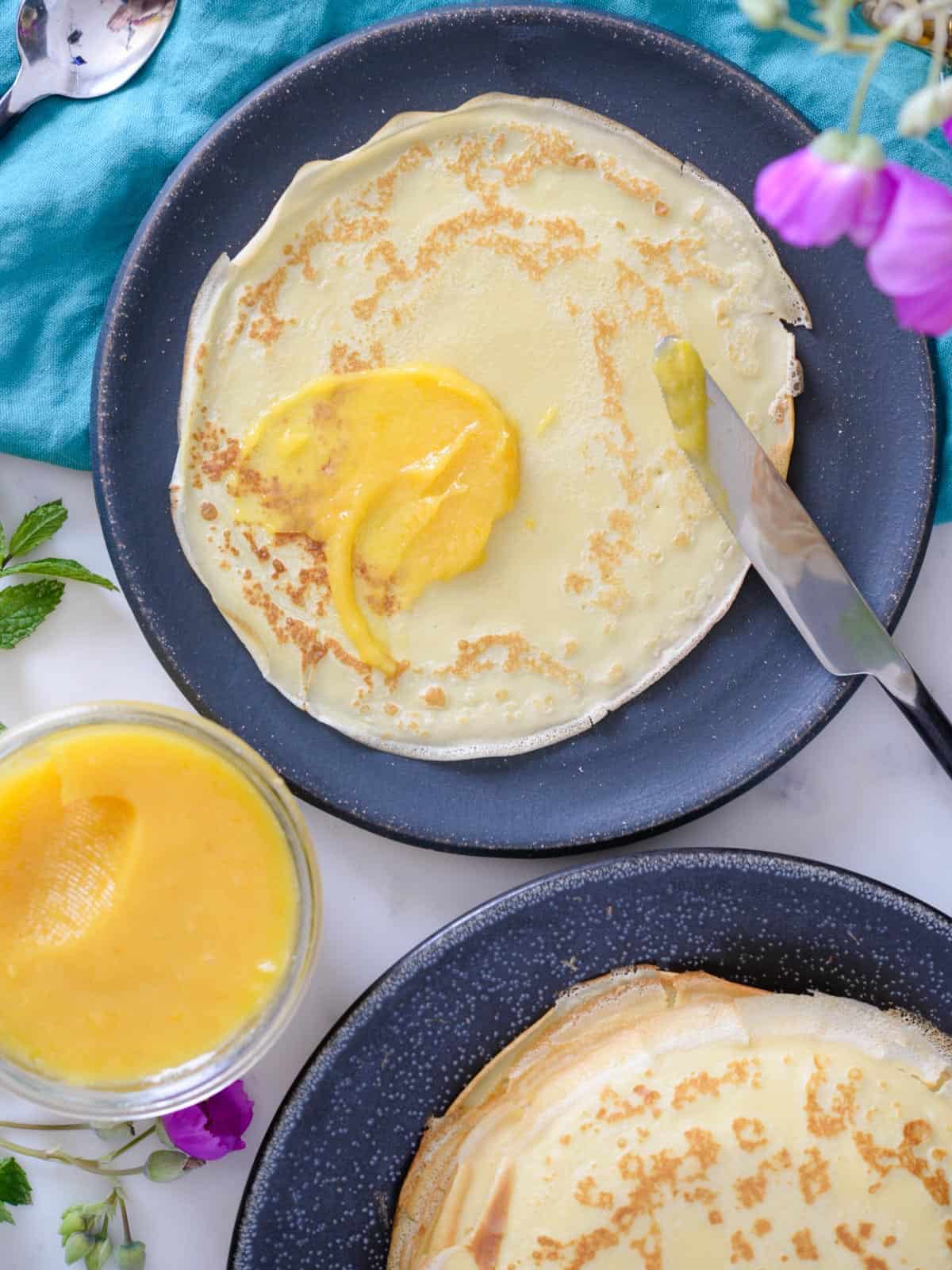 one french crepe with lemon curd spread on it