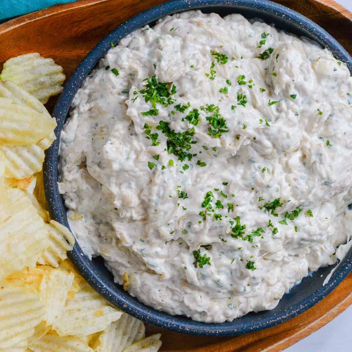 french onion dip from scratch in a bowl served with chips
