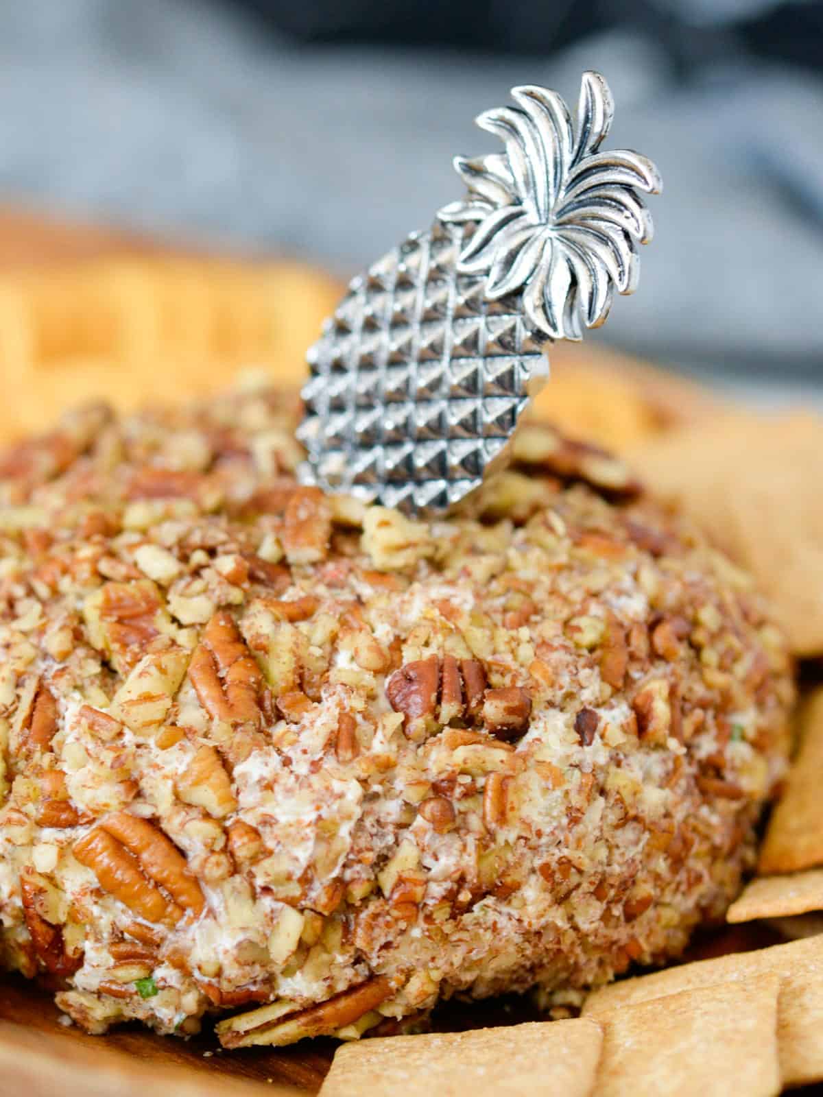 The original kraft pineapple cheeseball covered in pecans, served with ritz crackers