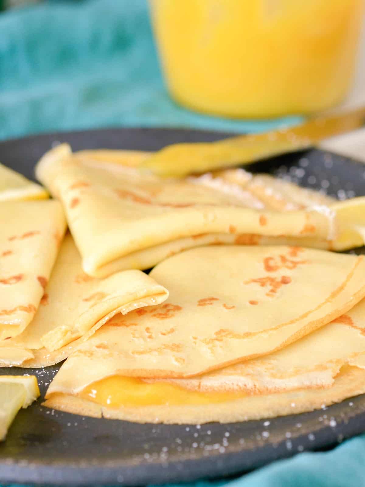 close up of french crepes with lemon curd filling