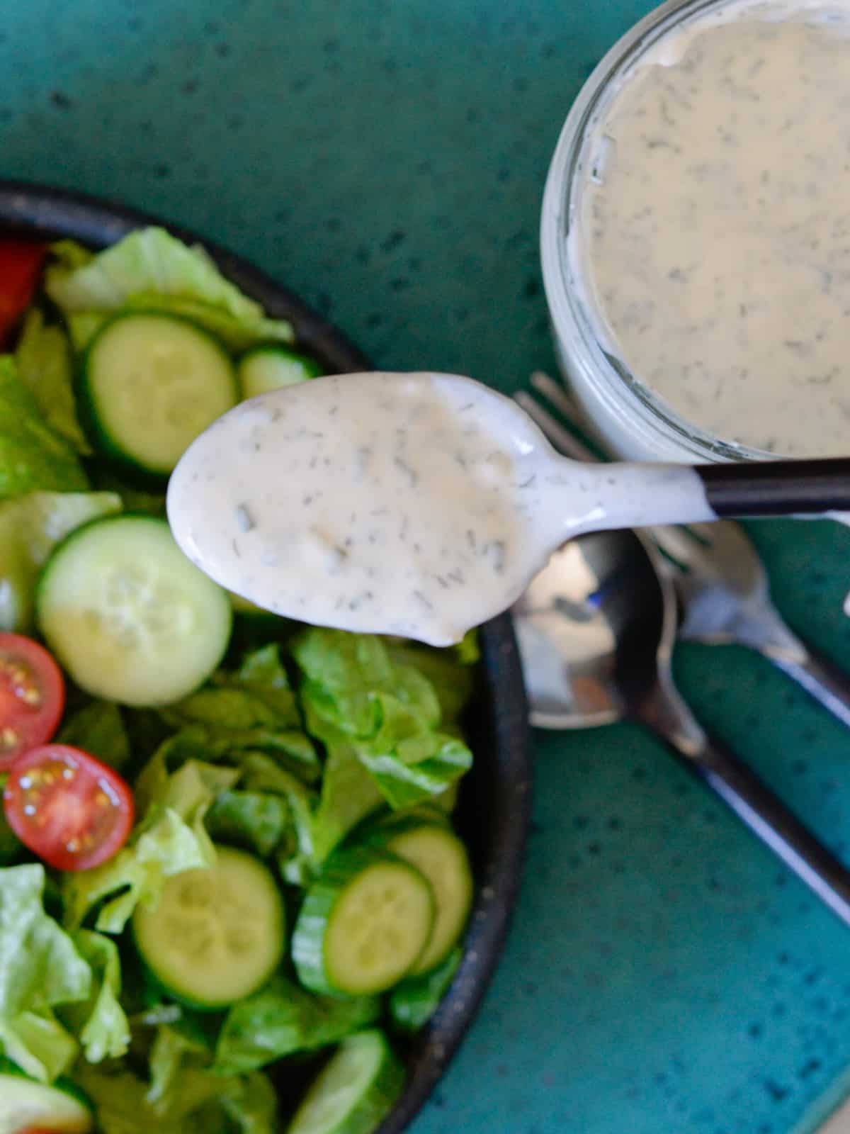 a spoonful of ranch showing the herbs