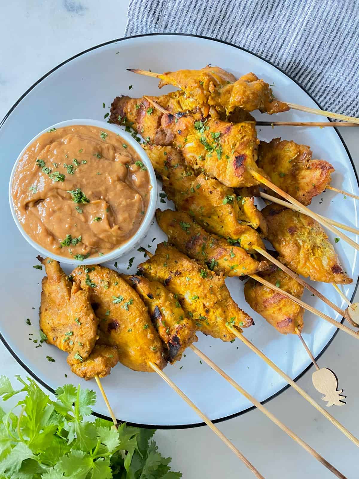 chicken satay in the foreground
