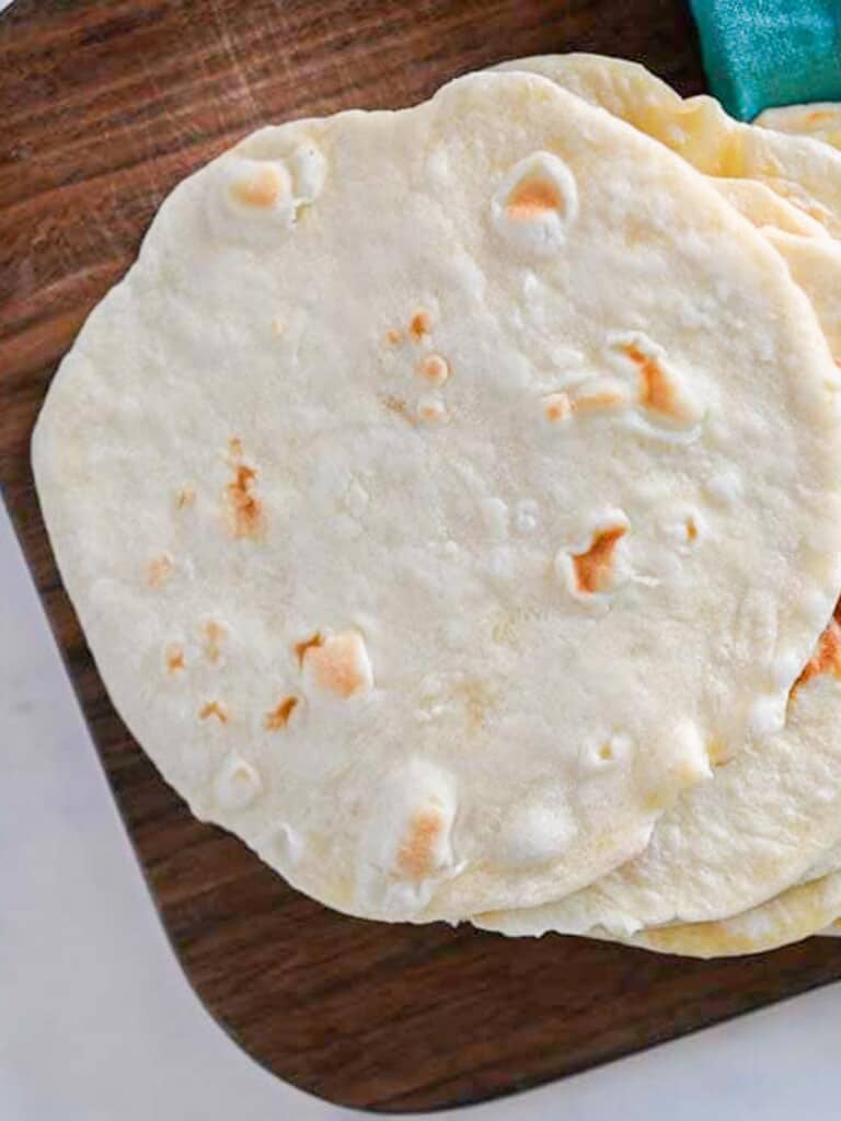 a stack of easy homemade flour tortillas, resting