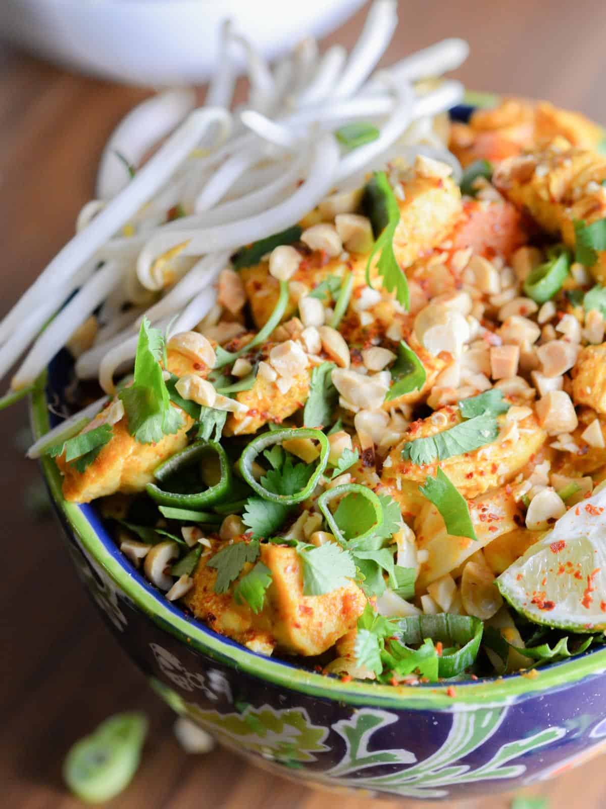 noodle bowls topped with peanuts