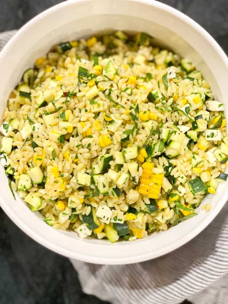 summer pasta salad with orzo, corn, zucchini, and feta